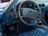 a blue car with a steering wheel and dashboard