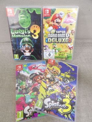 quelques jeux Nintendo Wii posés sur un canapé