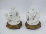 pair of antique porcelain figurines of a woman and child