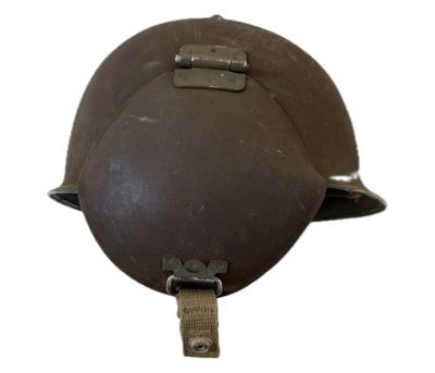 an old helmet with a metal buckle on a white background