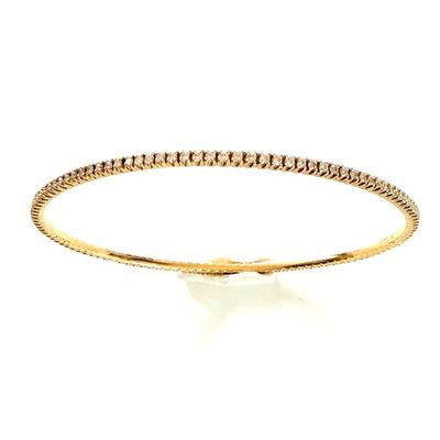 a yellow gold bracelet with diamonds on a white background