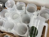 a box full of plastic cups sitting on top of a table