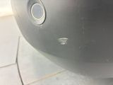 a close up of a car ' s bumper with a hole in it