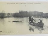 a black and white photo of people in a boat on the water