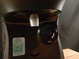 a coffee maker that is sitting on a wooden table
