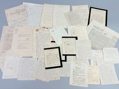 a pile of old letters and papers on a table