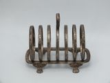 an image of a silver plate holder with four rings on it