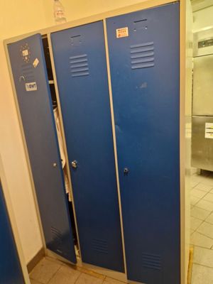 two blue lockers next to each other in a bathroom