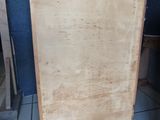 a wooden cabinet that is sitting on a tile floor