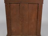 an old wooden cabinet with a marble top on wheels