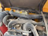 a close up of a car ' s engine with its hood open