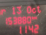 a digital clock on the side of a bus