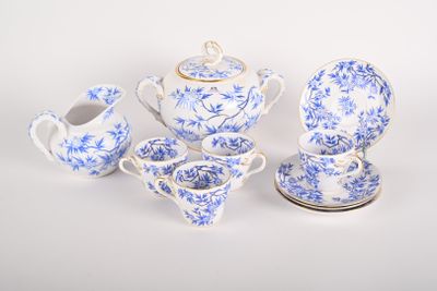 blue and white porcelain tea set with teapot, saucer, cup, and saucer