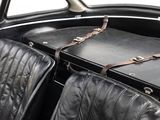 a black suitcase sitting on top of two black leather seats