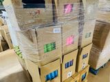 many boxes stacked on top of each other in a warehouse