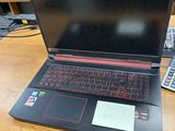 a laptop that is sitting on a desk with a keyboard