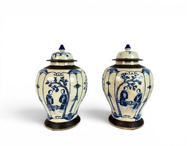 pair of chinese blue and white vases with lids on stands