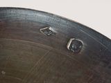 close up of a metal pan with a hole in the bottom