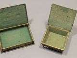 two small boxes that are sitting next to each other