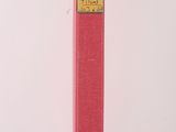 the book is red and has a yellow label on it