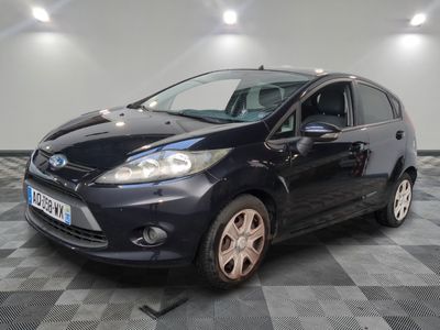 a picture of a black ford fiesta parked on a checkered floor