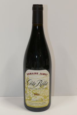 a bottle of wine that is sitting on a table