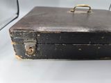a black suitcase sitting on top of a white table