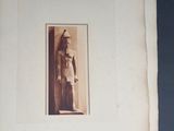an old book with a picture of a man in a hat