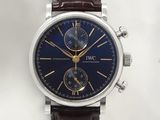 a close up of a wrist watch with a blue dial