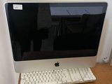 a computer on a desk with a keyboard and mouse