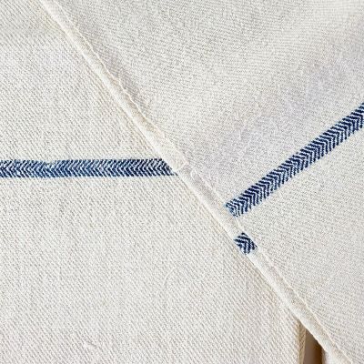 a close up of a white shirt with a blue stripe on it