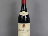 a bottle of wine that is sitting on a table