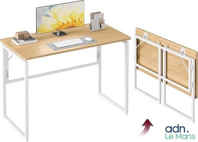 une photo d'un bureau d'ordinateur sur lequel est posé un ordinateur portable