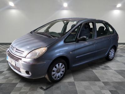 a picture of a silver car parked in a garage