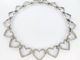 an image of a heart shaped necklace on a white background