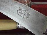 a knife that is laying on top of a box
