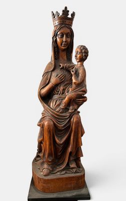 a statue of a woman holding a child in her arms