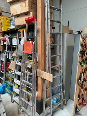 a ladder that is leaning against a wall in a garage