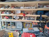 a lot of clutter and tools in the back of a truck