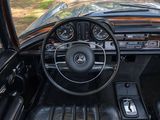 the interior of a car with a steering wheel, dashboard and dashboard controls