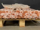 a wooden pallet with a bunch of bags of food on it