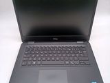 the dell laptop is open and ready to be used