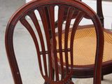two chairs that are sitting next to each other