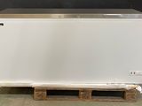 an image of a white chest freezer on a pallet