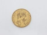 a gold coin with the head of a man on it