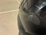a close up of a car ' s hood with a sticker on it