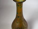 a vase that is sitting on a white surface
