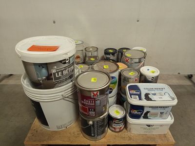 many cans of paint and cans of paint on a pallet