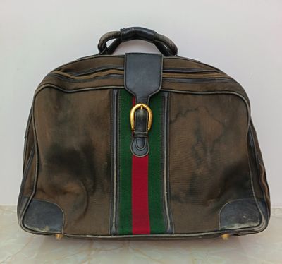 a brown bag with a green, red and green stripe on it
