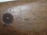 a close up of a piece of wood with writing on it